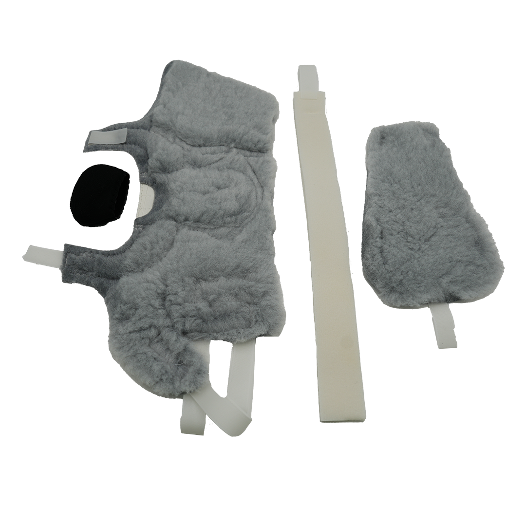 Gray fleece-lined orthopedic accessory kit pieces including a large contoured pad, a smaller shaped pad, and a long beige.