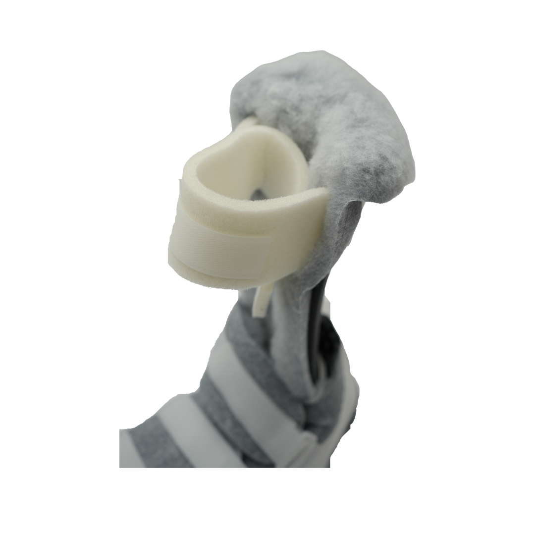 White ambulatory attachment with padded soft foam cuff and adjustable straps on gray orthopedic brace, made in the USA,.