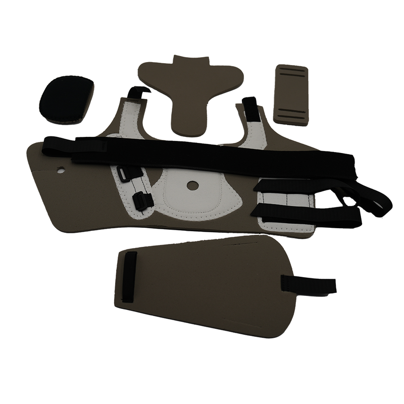 Set of olive drab and black padded medical accessories including a long rectangular strap with loops, two curved shield-like