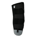 Black below-knee amputee rigid dressing protector with three adjustable straps and gray reinforced bottom panel, made in the .