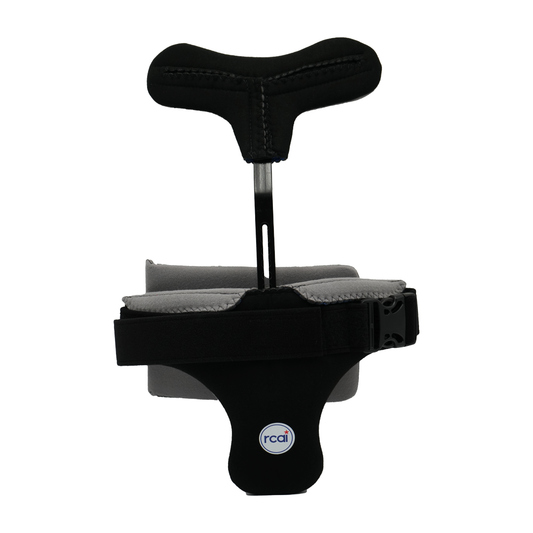 Black hyperextension orthosis with cushioned T-shaped pad, adjustable straps, and rcaI logo, made in the USA, b2b.