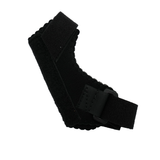 Black pediatric universal thumb support with adjustable strap and hook-and-loop closure, featuring scalloped edges, made in.