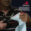 Close-up of white pediatric abdominal binder being precision cut with scissors, showing soft, adjustable medical-grade.