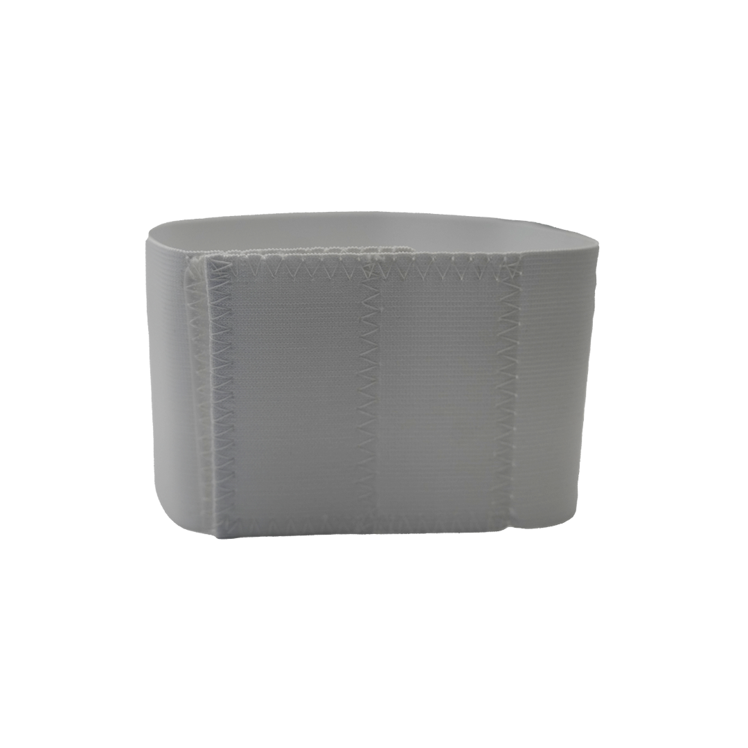 White pediatric abdominal binder with soft, adjustable fabric and secure hook-and-loop closure, made in the USA, best.