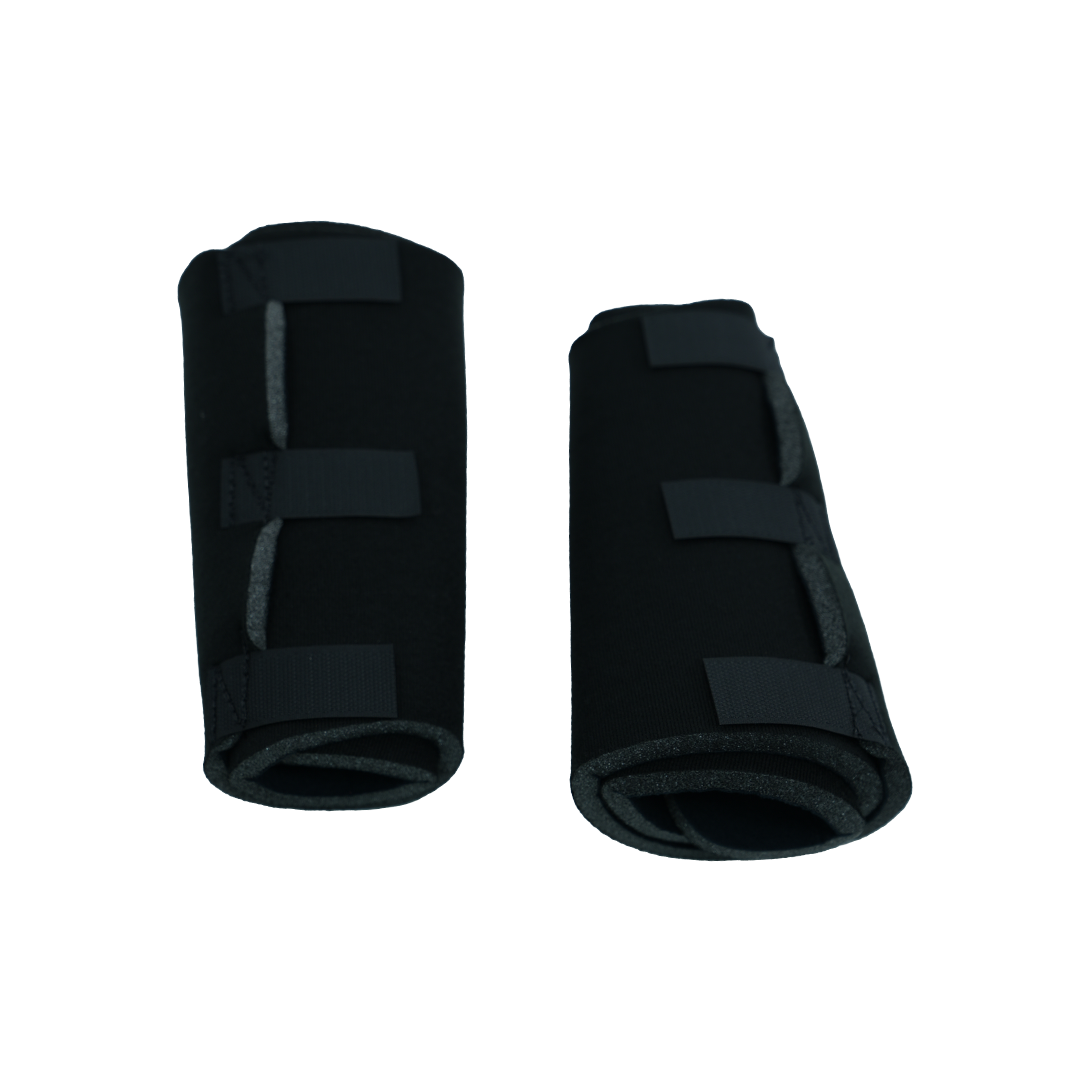 Pair of black pediatric post operative knee brace accessories with adjustable Velcro straps, made in the USA by RCAI, top.