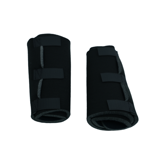 Pair of black pediatric post operative knee brace accessories with adjustable Velcro straps, made in the USA by RCAI, top.