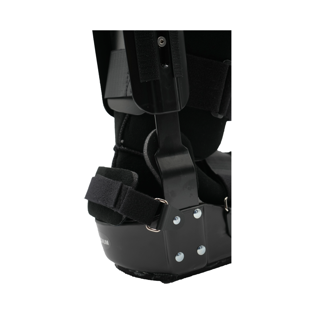 Close-up of black RCAI TA Boot ankle brace with sturdy metal hinges and adjustable Velcro straps, showcasing durable.