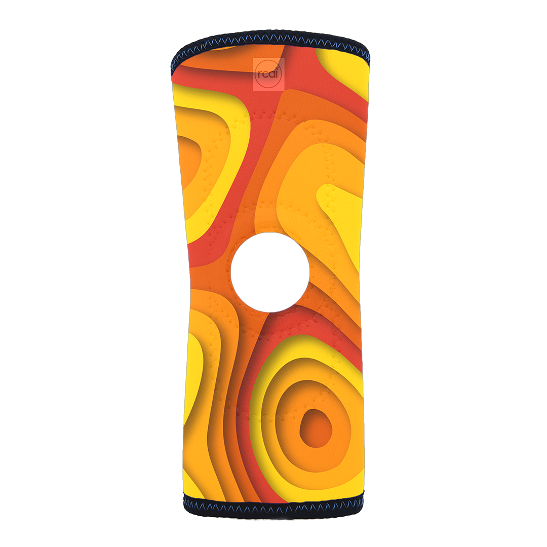 RCAI reversible knee sleeve with vibrant orange, red, and yellow layered contour pattern, made in the USA, best orthopedic.