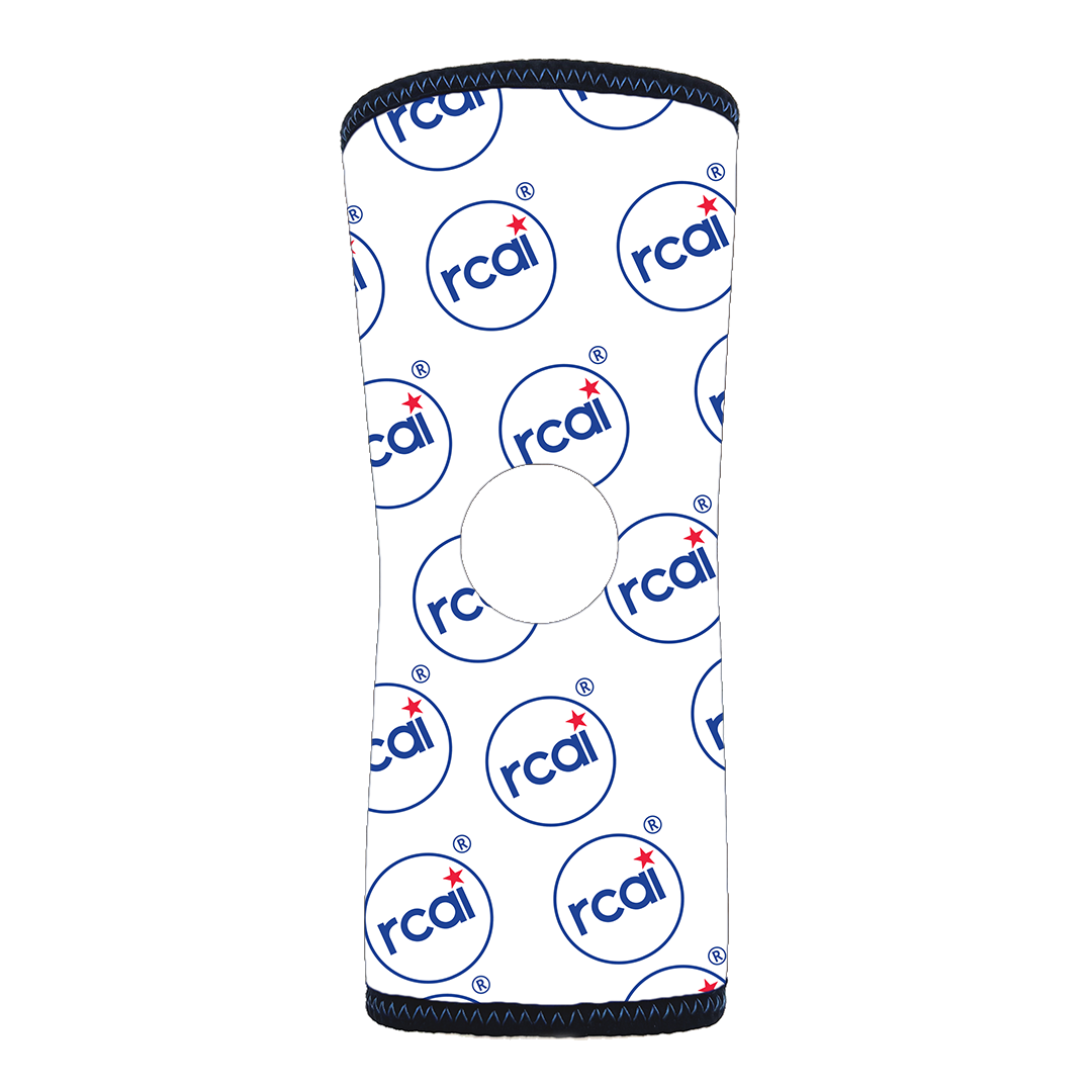 White knee sleeve with repeating blue and red RCAI logo pattern, black trim edges, designed for infants, made in the USA,.