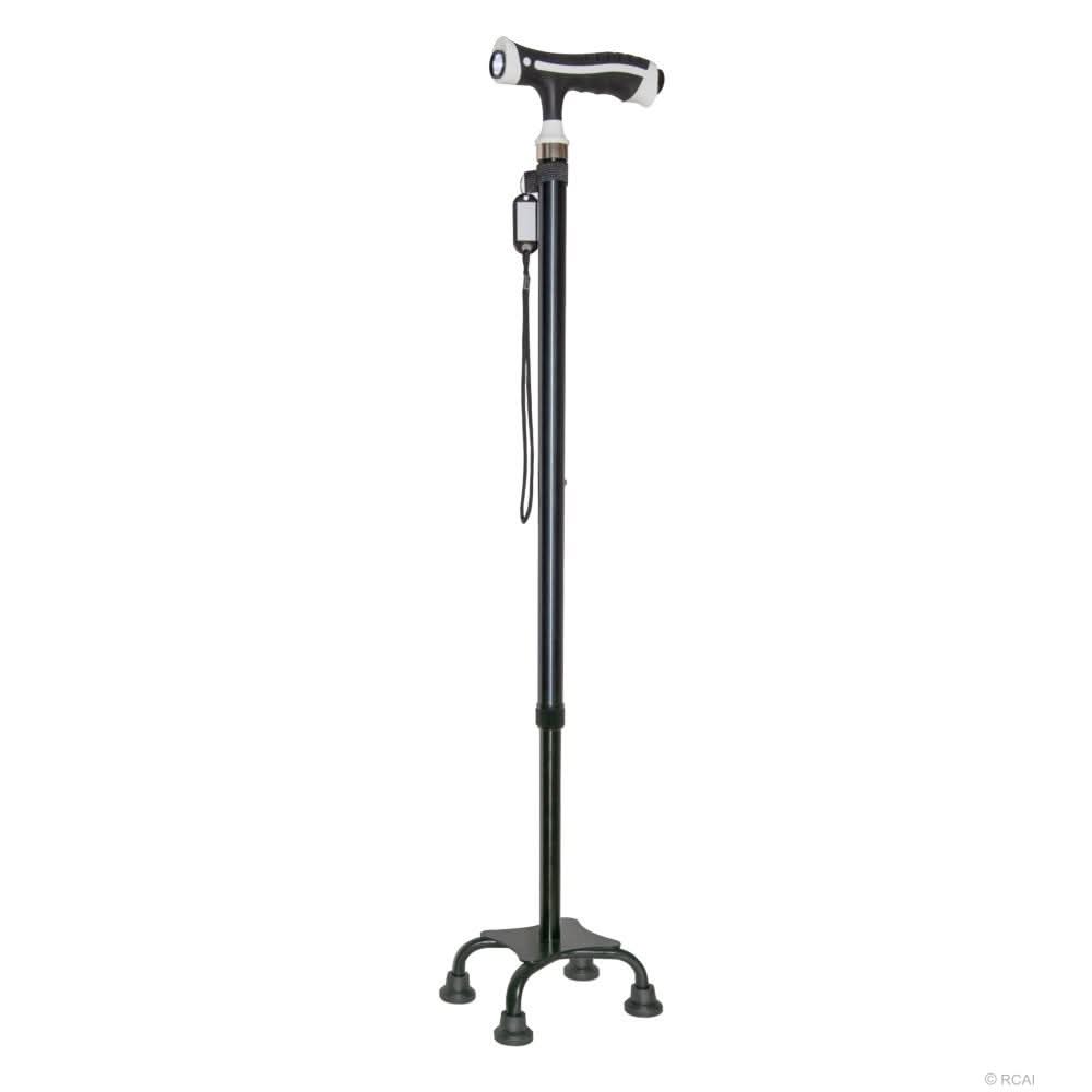 Black adjustable self-standing cane with ergonomic white and black handle, quad base for stability, made in the USA, ideal.
