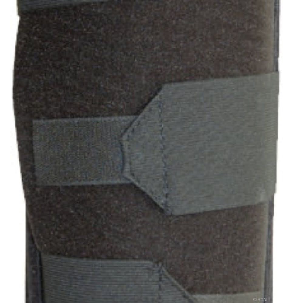 Below knee amputee rigid dressing protector in dark gray fabric with a wide gray adjustable strap, made in the USA, RCAI,.