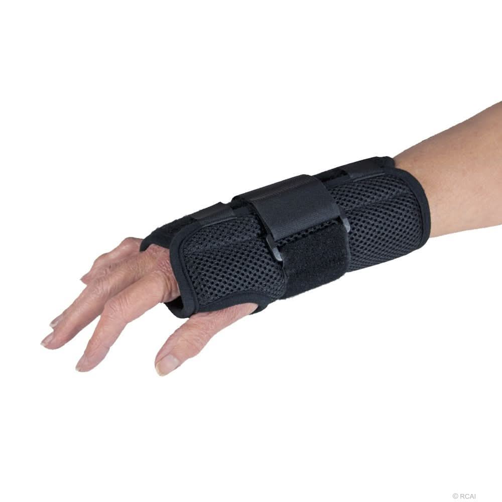 Black ambidextrous wrist brace with breathable mesh fabric, adjustable straps, and reinforced support, designed for optimal.