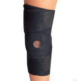 Black wrap-around knee brace with open patella and buttress, secured with wide Velcro straps, made in the USA, RCAI, b2b.